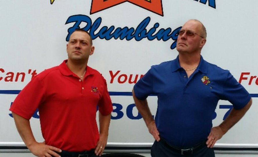The Star Rooter Plumbing team in front of a company truck