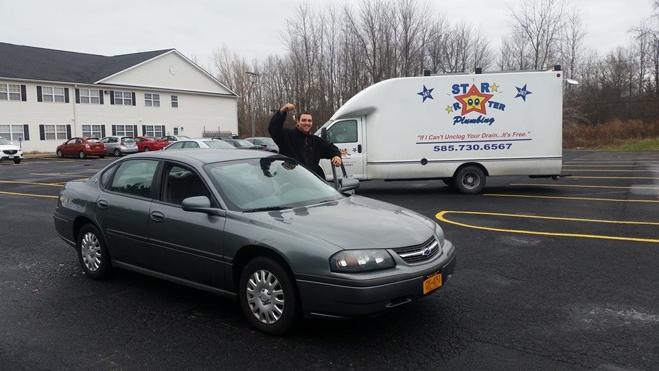 Star Rooter Plumbing technician with the company truck at a commercial property